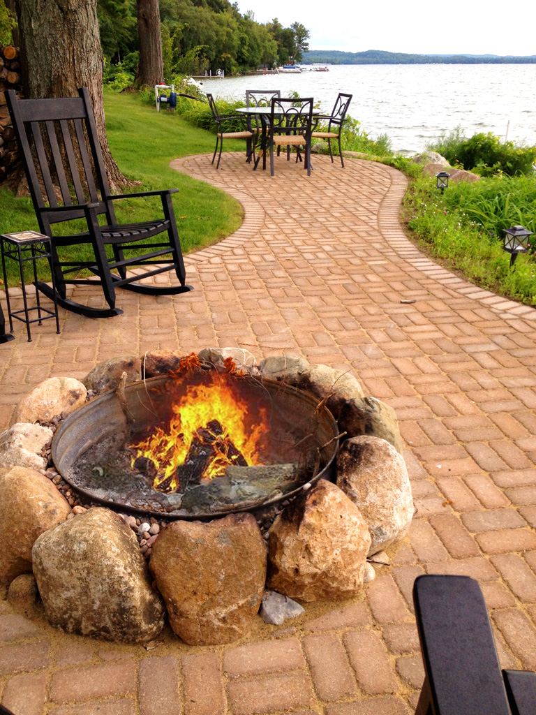 large stones encircle outdoor fire pit